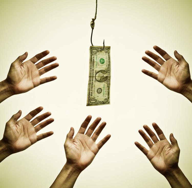 hands reaching towards dollar bill on a fishing hook